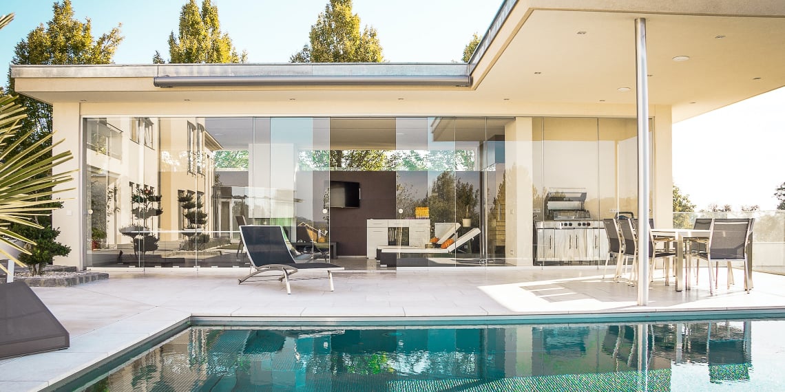 house with large windows on the pool